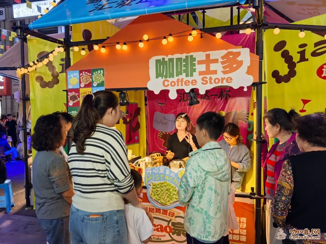 Visitors queuing at a coffee stall